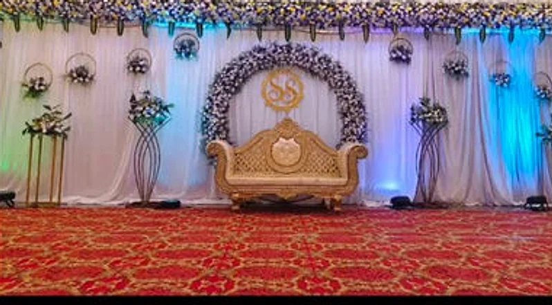 A reception stage with floral arch
